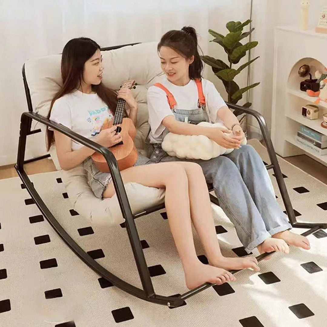 Tow woman lies on a Relaxing Rocking Chair,