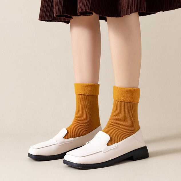 A girl wearing 1 Pair of Thick Winter Socks