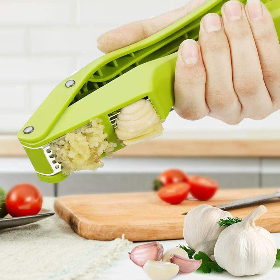 A Person is Pressing Garlic Using 2 in 1 Garlic Press.