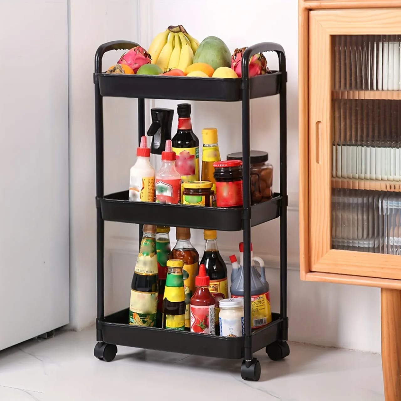 A 3-tier Trolley Cart is Organized with Food Items.
