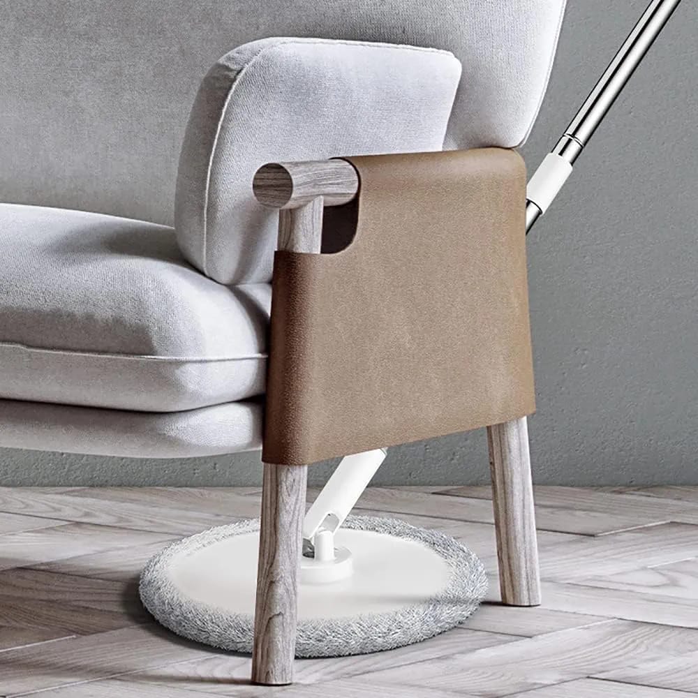Someone is cleaning down the chair using a 360° Spin Mop and Bucket Set