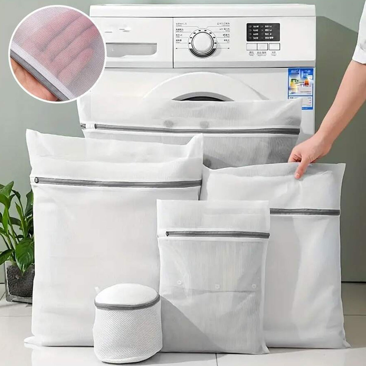 4 Pcs Mesh Laundry Washing Bags Set in front of a washing machine.