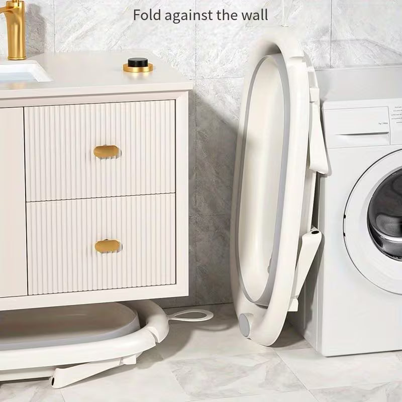 A Bathub in a 5-in-1 Baby Foldable Bathtub Set is Folded against wall.