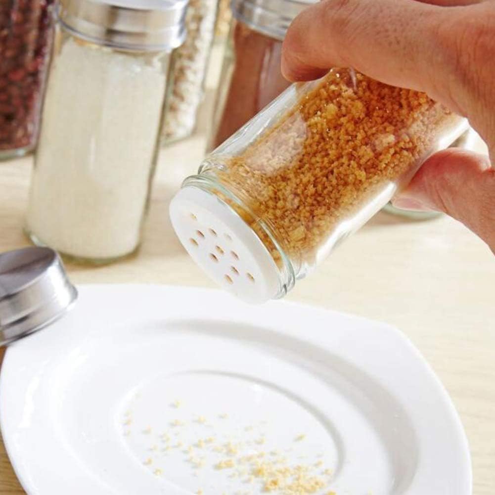 Someone holding 8/12 Spice Jars Carousel Stainless Steel Rotating Spice Rack