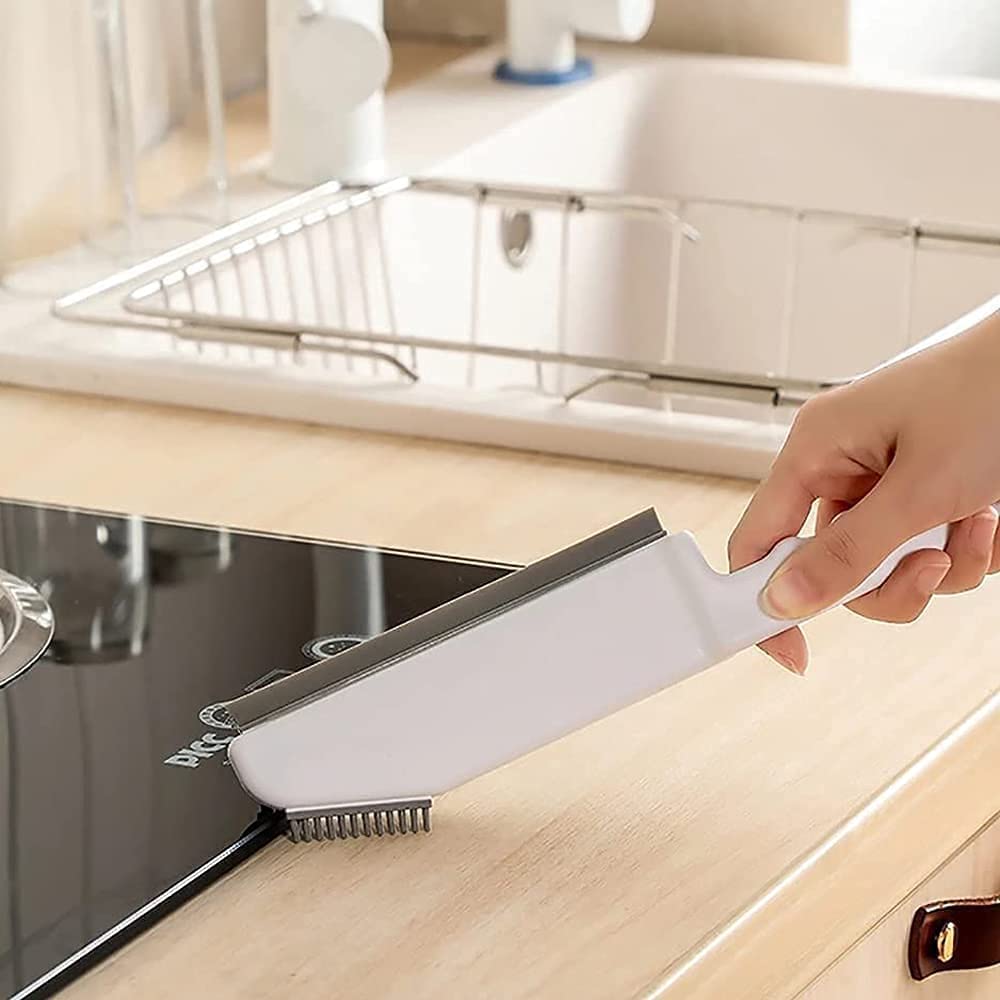 Someone is using a 3-in-1 Multifunctional Cleaning Brush in the kitchen