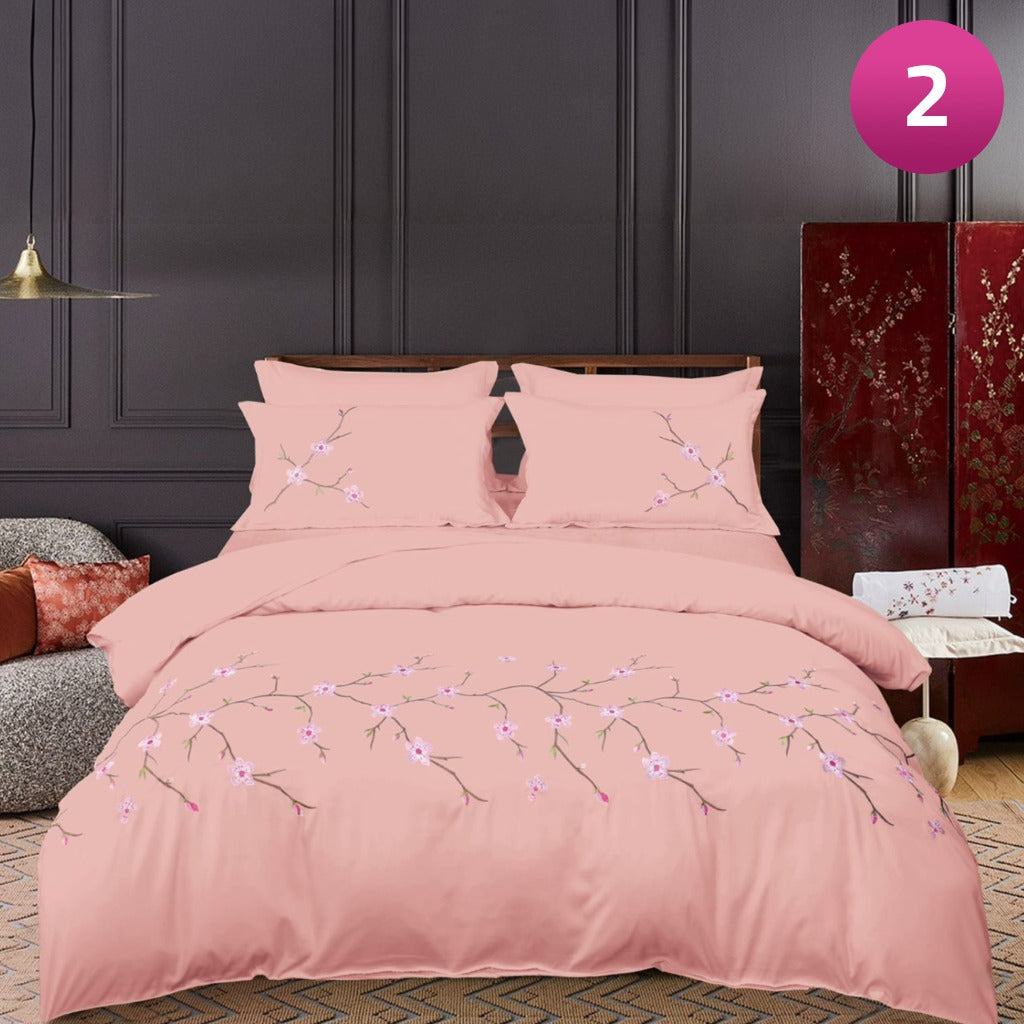 6-piece bedding set with floral comforter, fitted sheet, and pillow covers on a king bed.