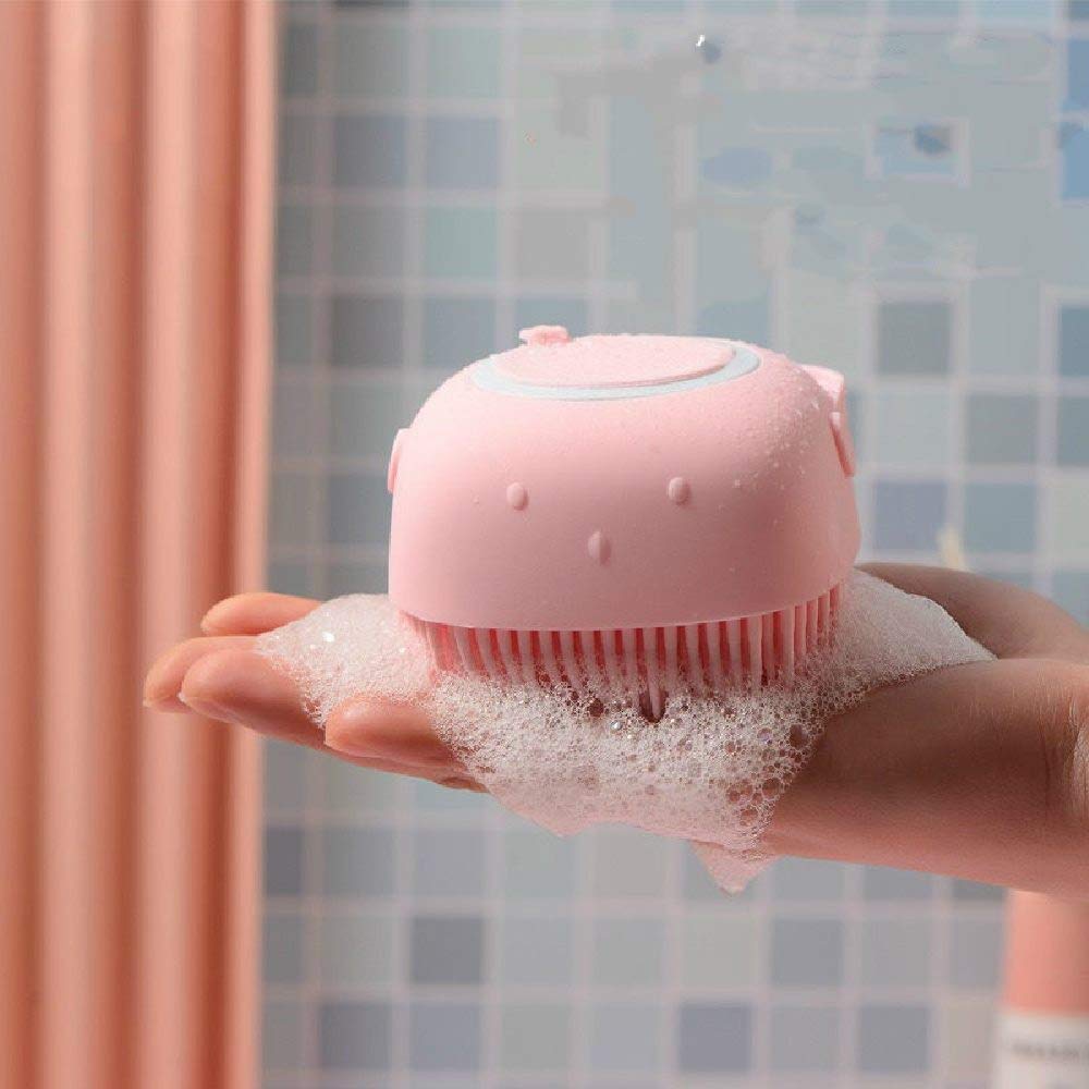 A kid holding a silicone shampoo body bath scrubber comb brush