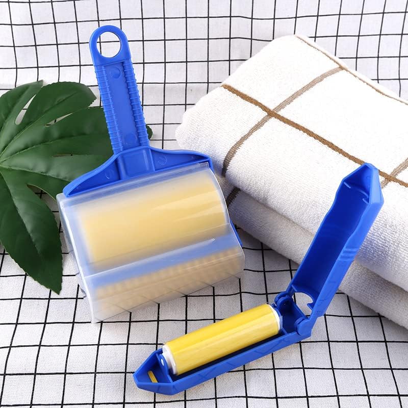 Sticky Buddy Reusable Sticky Picker Upper Roller next to towels