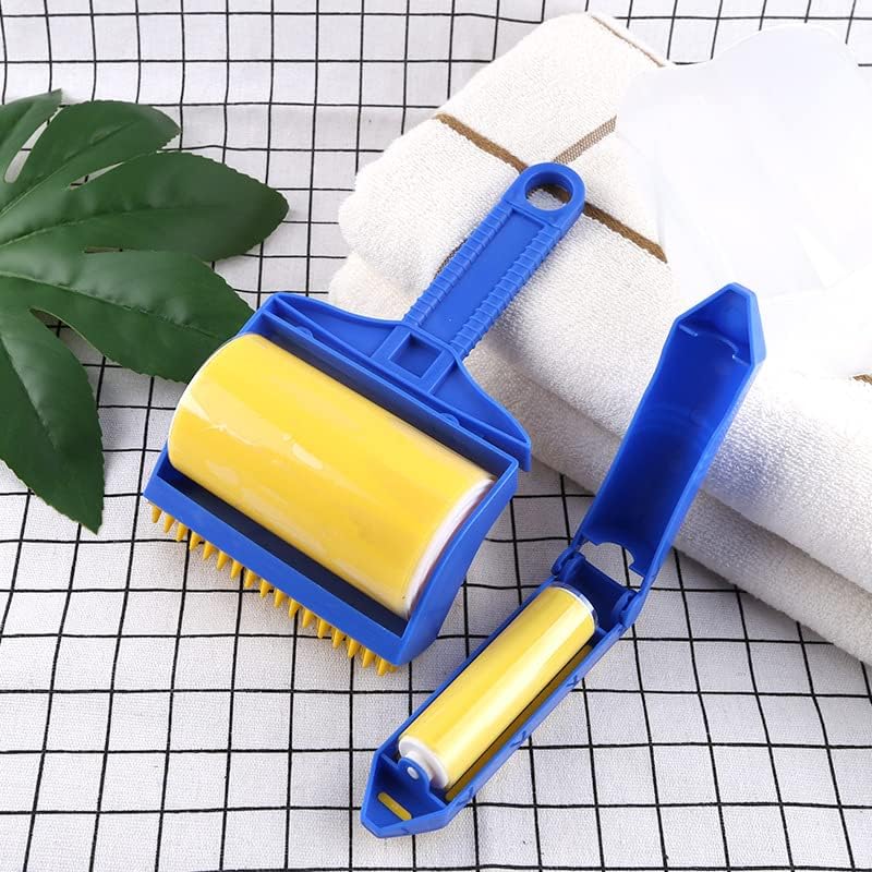 Sticky Buddy Reusable Sticky Picker Upper Roller next to towels