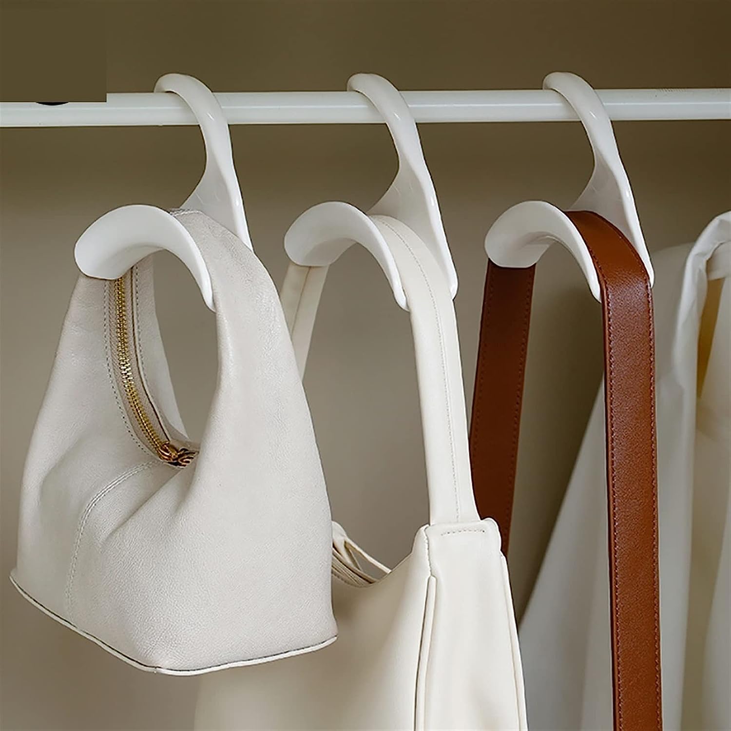 Efficiently organized rack showcasing various bags hung on specialized hanger hooks, ideal for saving space while organizing bags, belts, and scarves