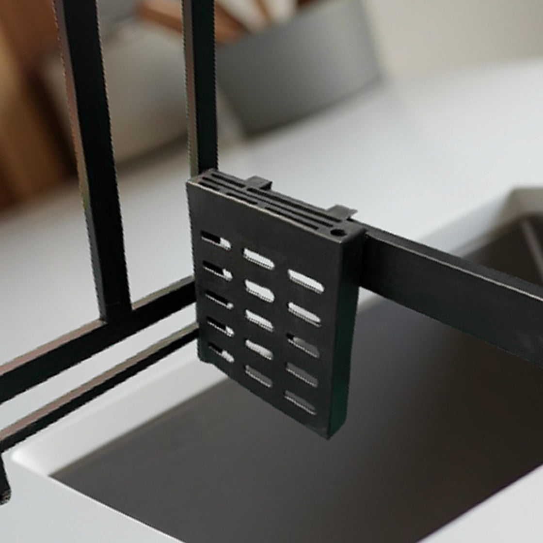 Parts Of A 2 Layer Kitchen Dish Drying Rack Placed Over Kitchen Sink.