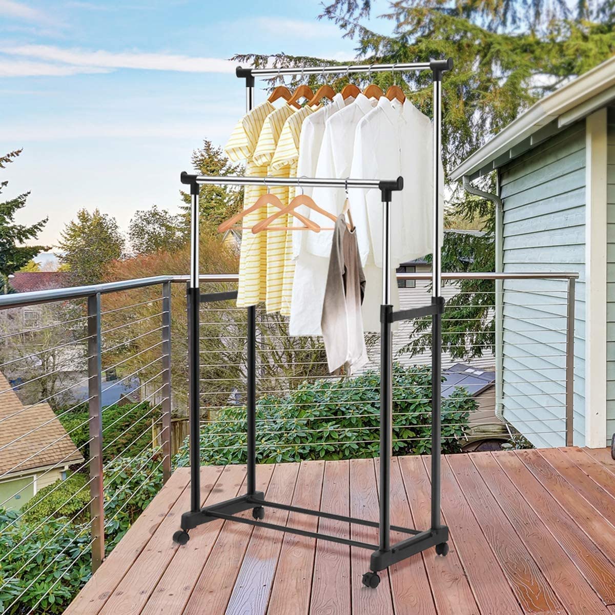 A Double Pole Portable Garment Rack is Organized with Clothes.
