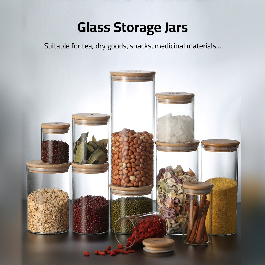 A Set Of Glass Storage Jars are Filled with Spices.