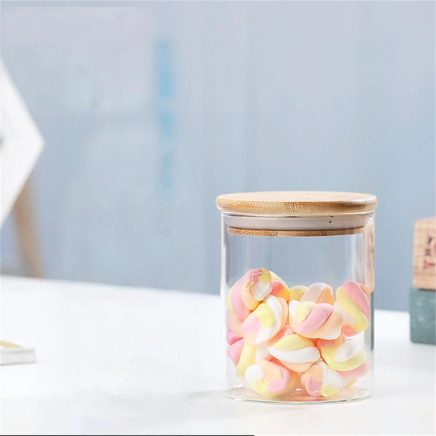 A Glass Storage Jar IS Stored with Candies.