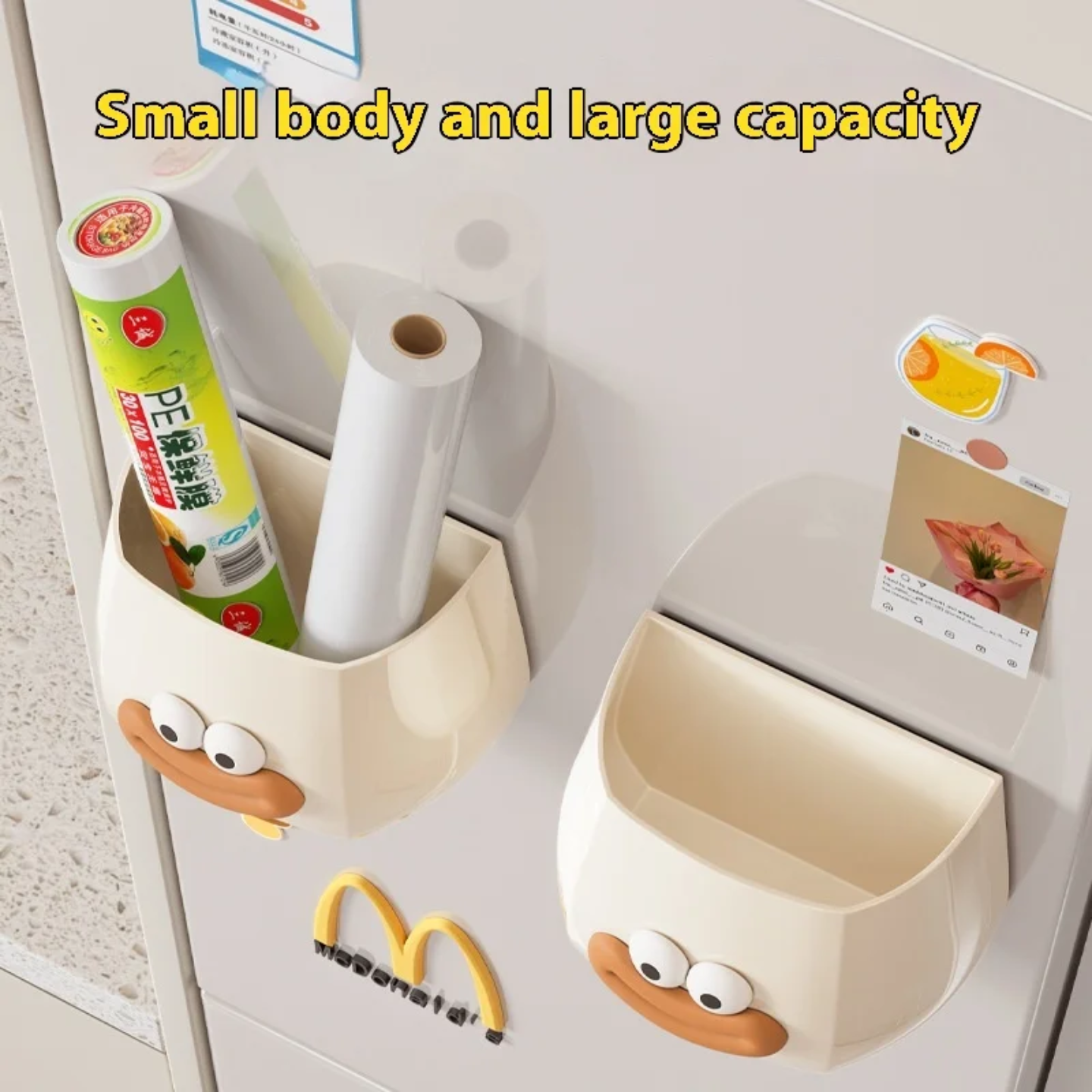 A cute cartoon-style wall-mounted organizer attached to a refrigerator, used to store plastic wraps or kitchen items.
