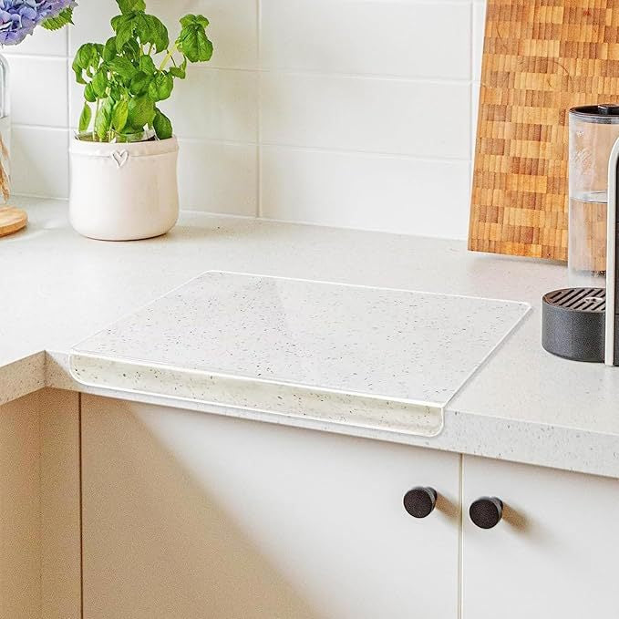 Acrylic Cutting Board is Placed on Kitchen Countertop.