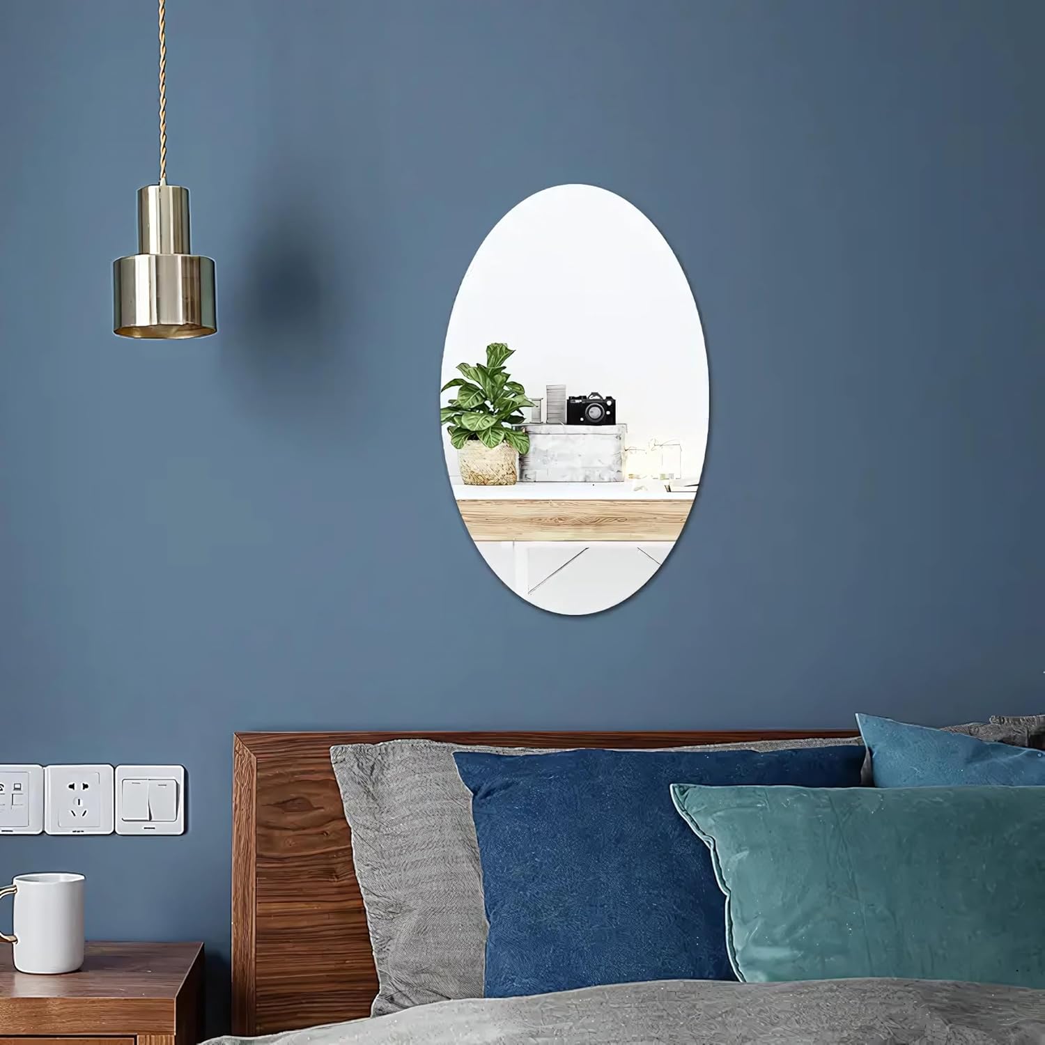 An Adhesive Mirror Wall Sticker is Fixed on the Wall Of Bedroom.