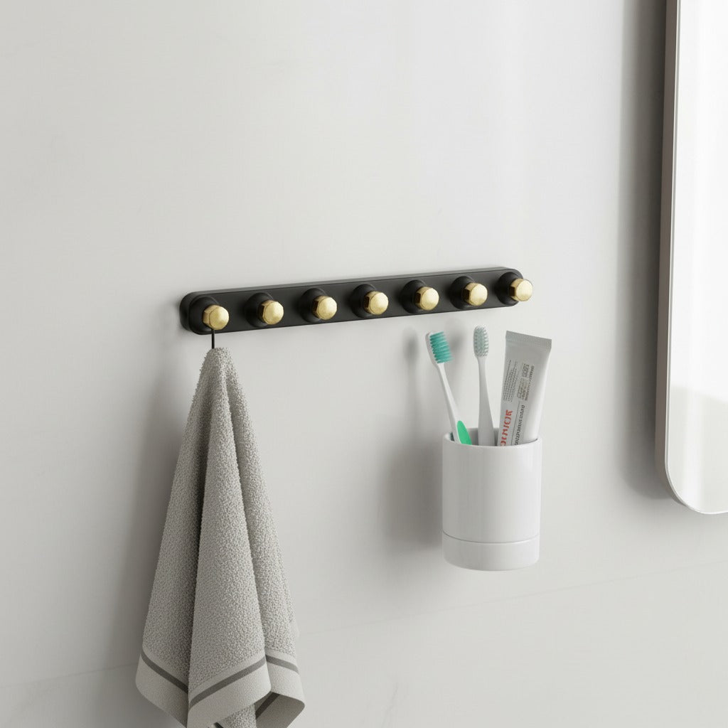 Adhesive Wall Hooks with a towel and a holder with toothbrushes on a light gray wall.