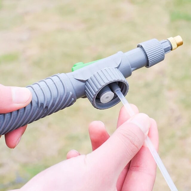 A Person is Holding Adjustable High Pressure Sprayer.