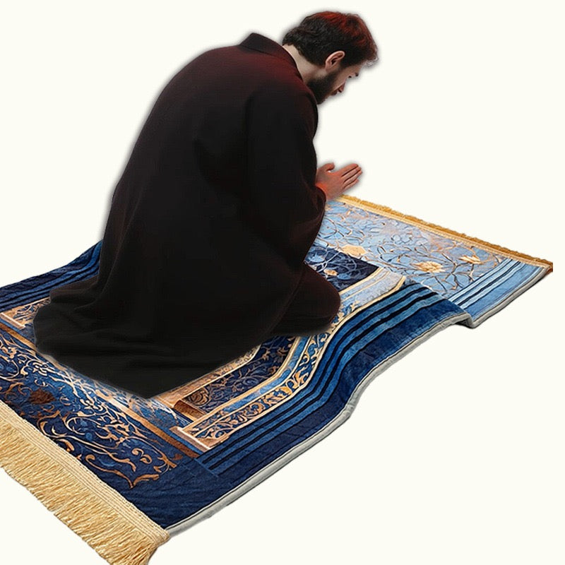 A Person is Praying On an Islamic Prayer Mat.