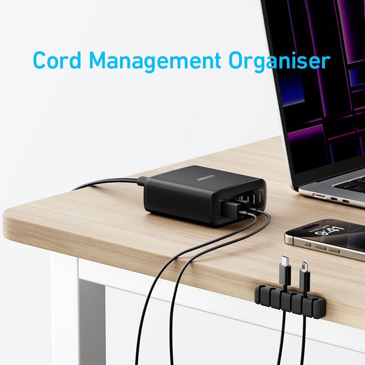 Anker 6-Port Multi-Device Fast Charger on a table, with cables neatly organized in a cord management organizer.
