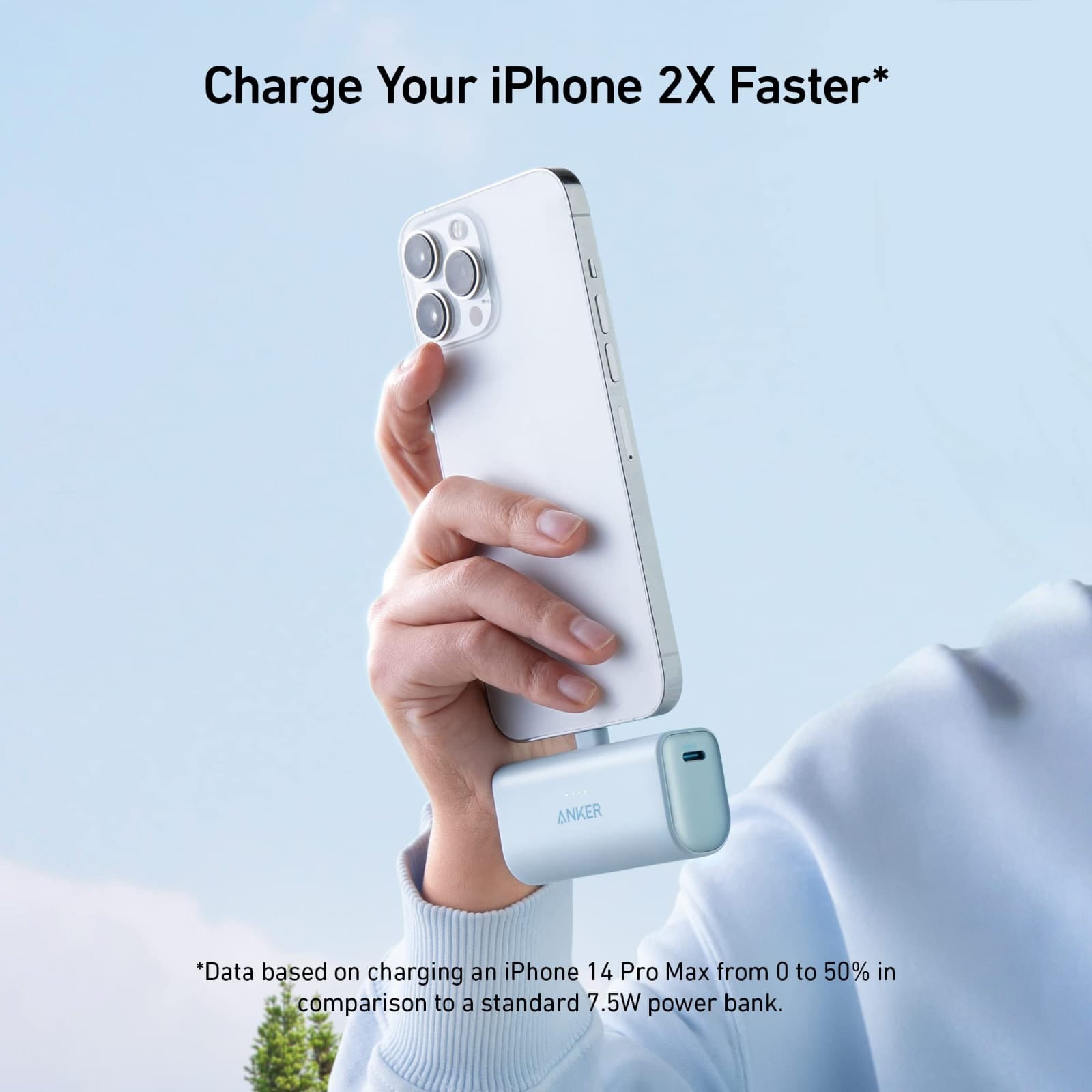 Someone is using a mobile phone while charging it with the Anker Nano Power Bank