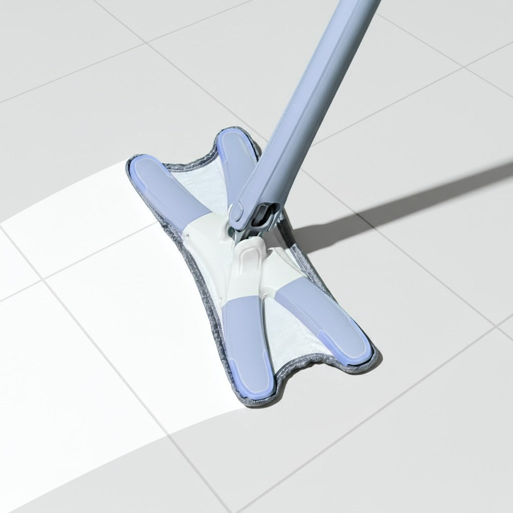 The white floor is being cleaned with an absorbent pad, which is part of the Aurora Twist Mop system.