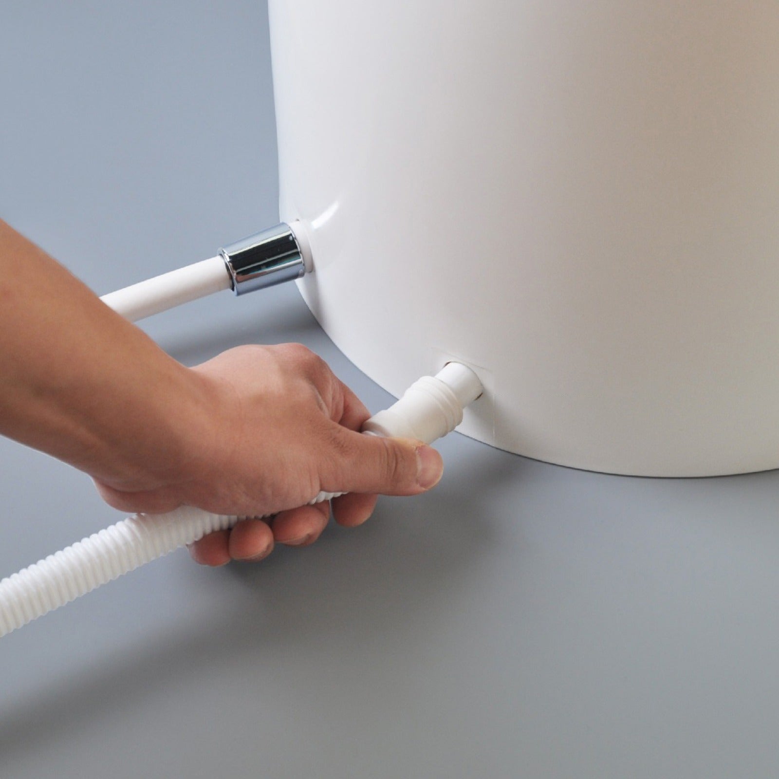 A Person is Installing Automatic Wudu Foot Washer Basin.