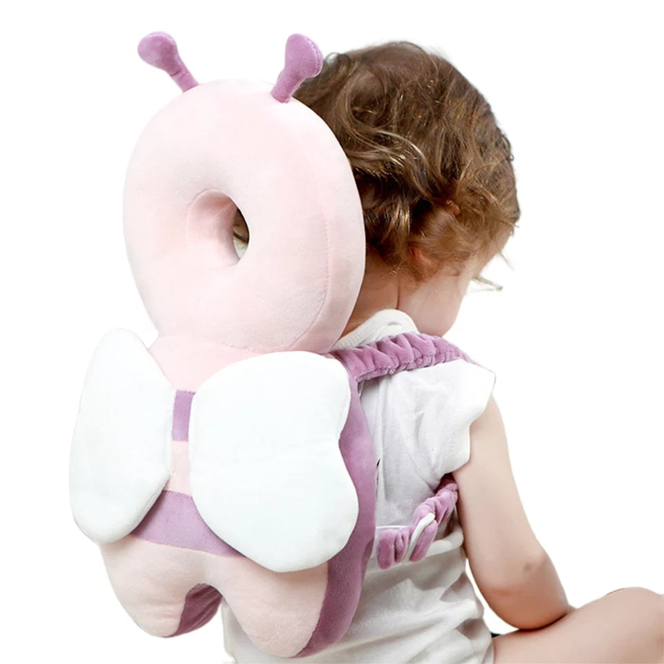 A Baby is Wearing Baby Head Protector Pillow.