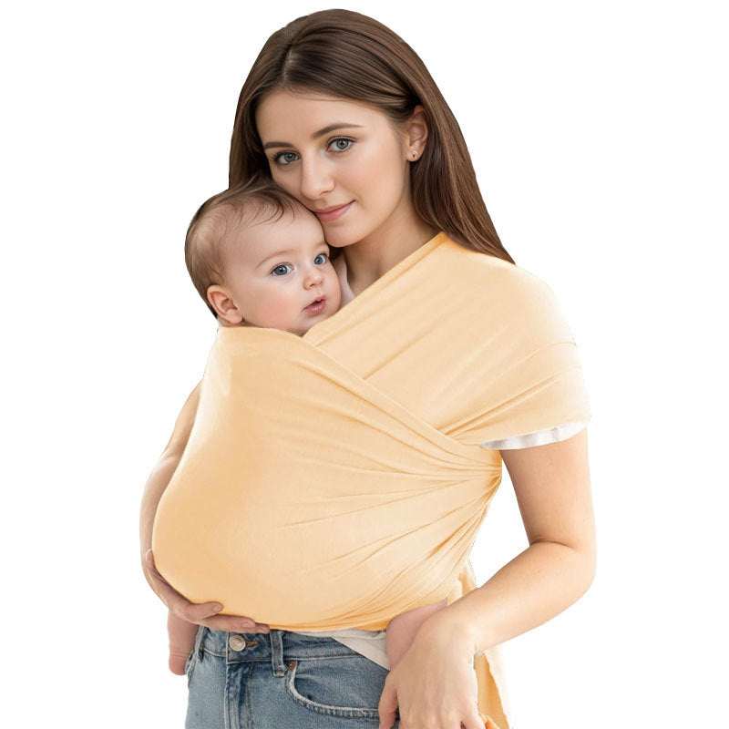 A Women is Holding Her Baby Using Newborn Baby Wrap Carrier Cloth in Beige Color.