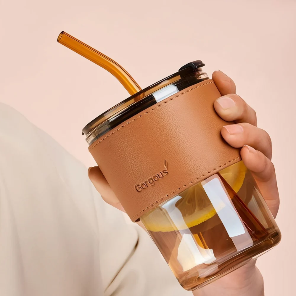 Someone is Holding Bamboo Glass Cup.