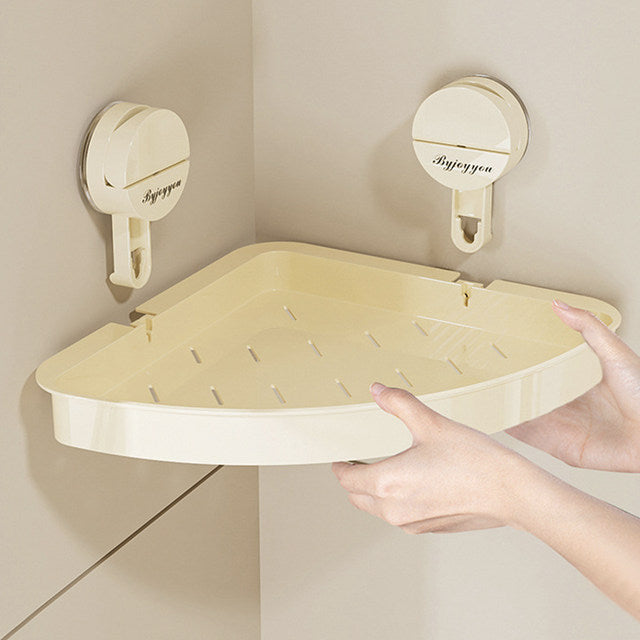 Someone is placing the Bathroom Storage Rack on the wall