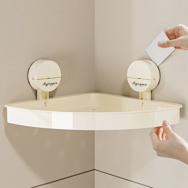 Someone is placing the Bathroom Storage Rack on the wall