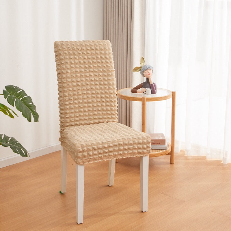 A Chair is Covered With Beige Bubble Stuff Stretchable Chair Cover