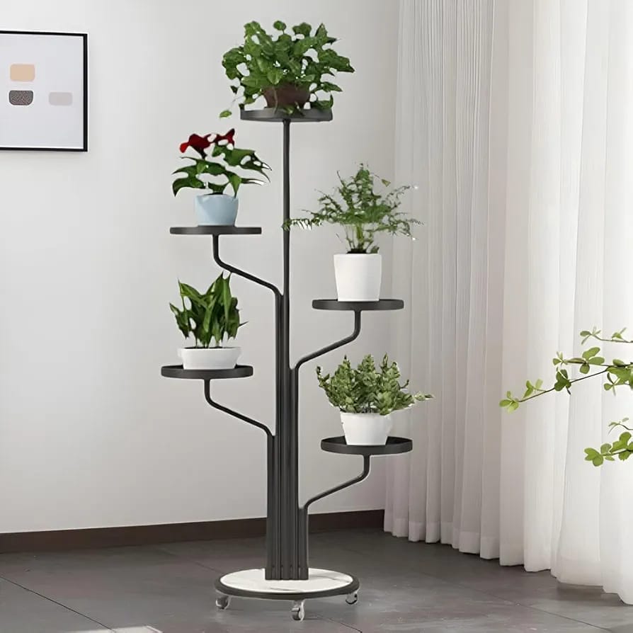 A Black Golden Indoor Plant Stands placed in a room along with plants