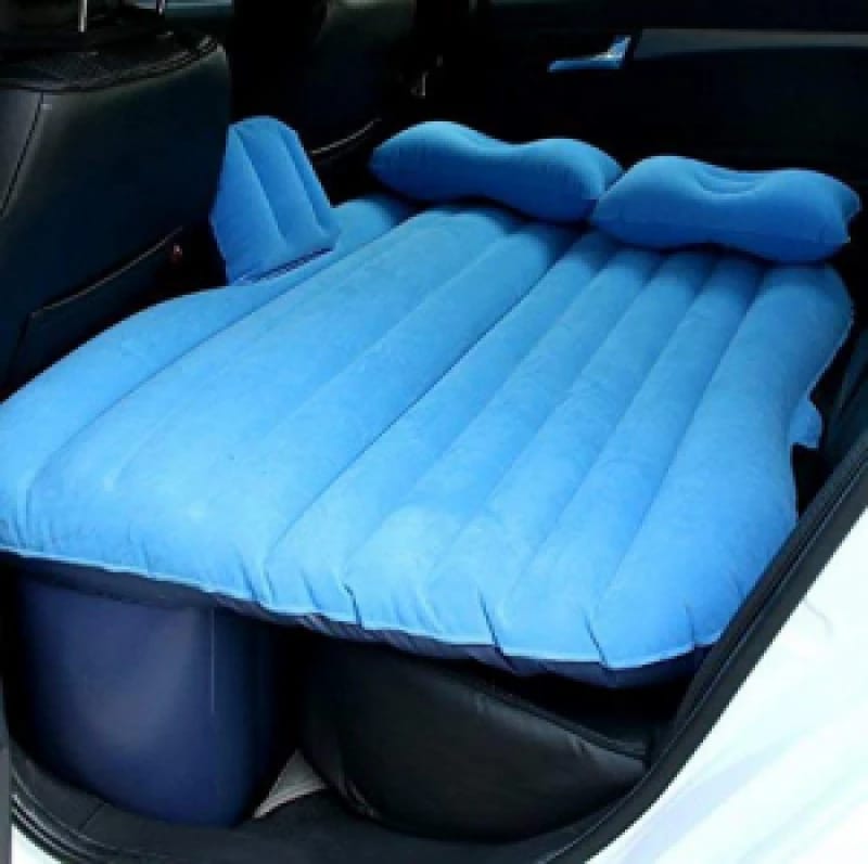 Blue color Inflatable Car Bed with pillow arranged in a car ready for use