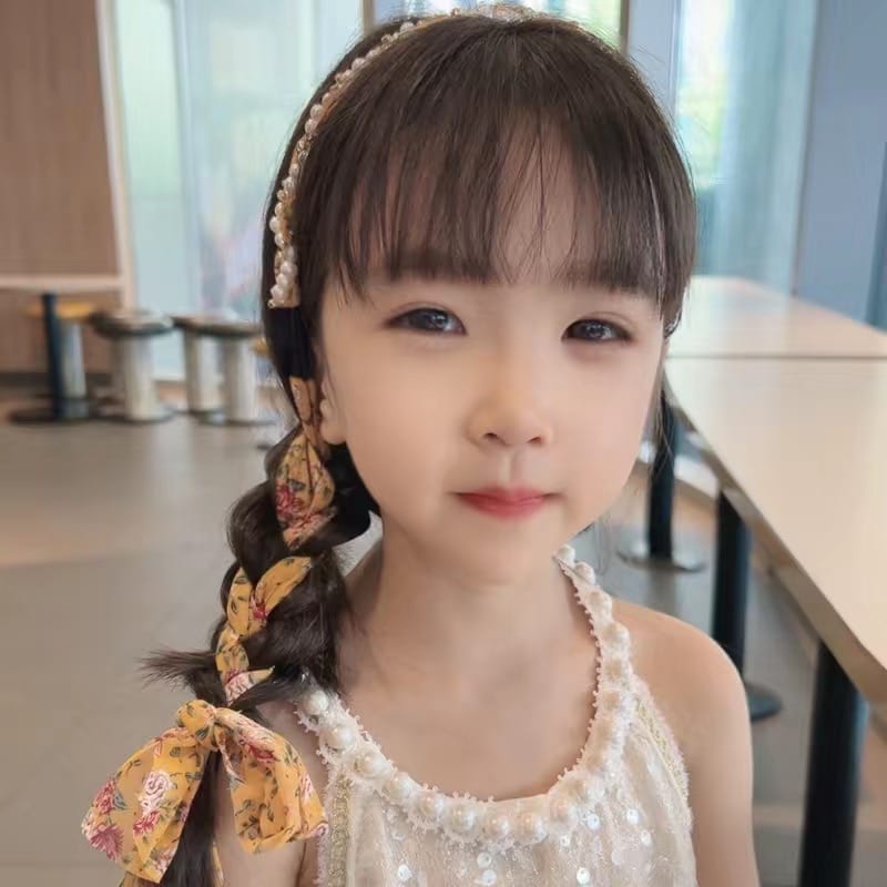 Cute Girl Wearing Braided Hairband.
