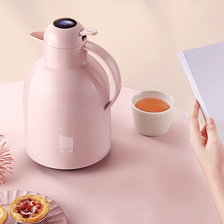 LED Temperature Display Vacuum Insulated Flask elegantly placed on the table next to a cup of tea