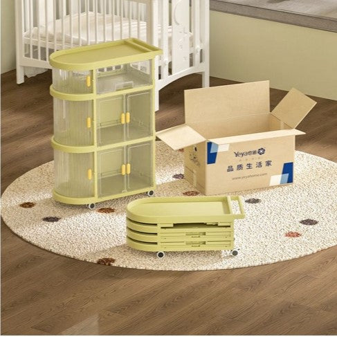 Free Installation Multi-Layer Folding Trolley Storage Rack placed on the floor next to a baby crib