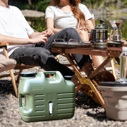 Camping Water Storage Container is Placed Near Camping Area.