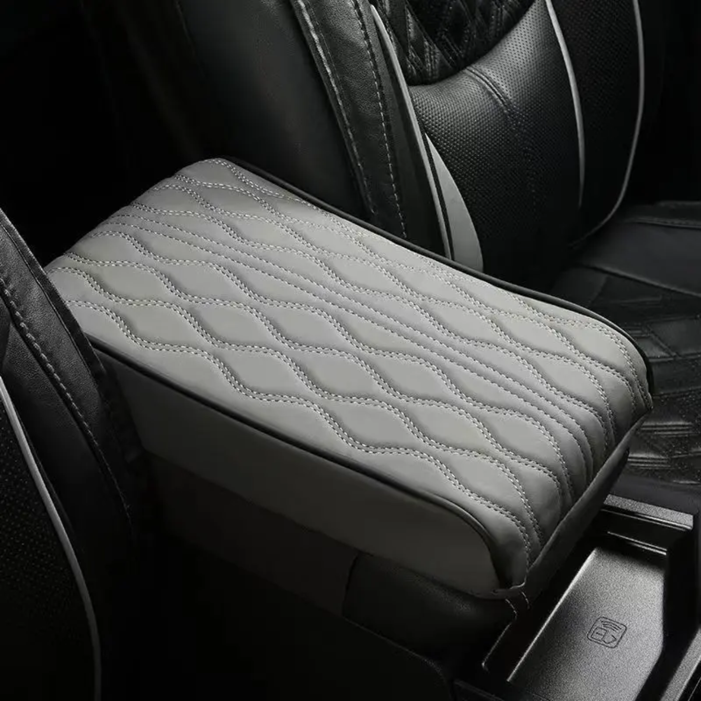 A Car Armrest Cushion is Placed on a Center Console of a Car.