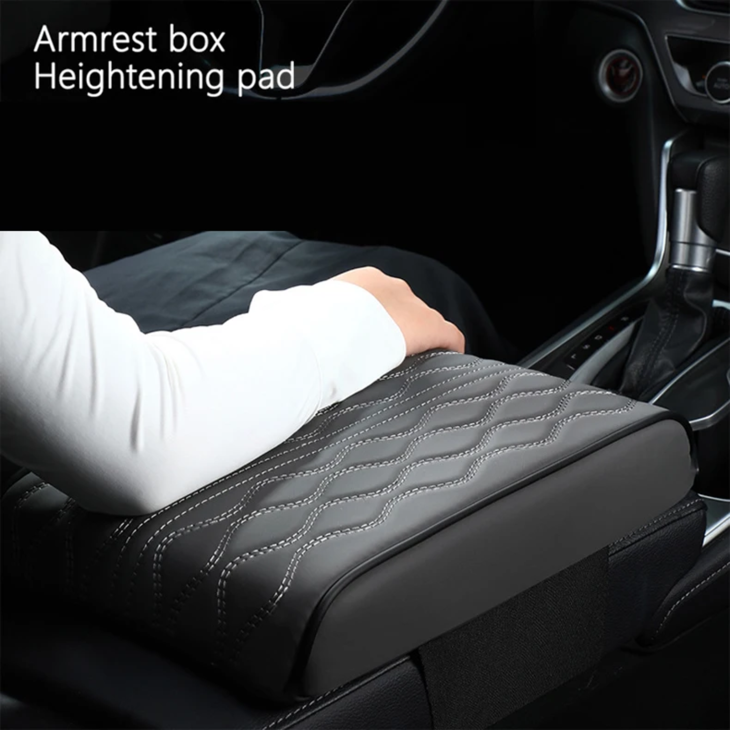 A Person is Placing his Elbow at Car Armrest Cushion Which is Placed on a Center Console of a Car.