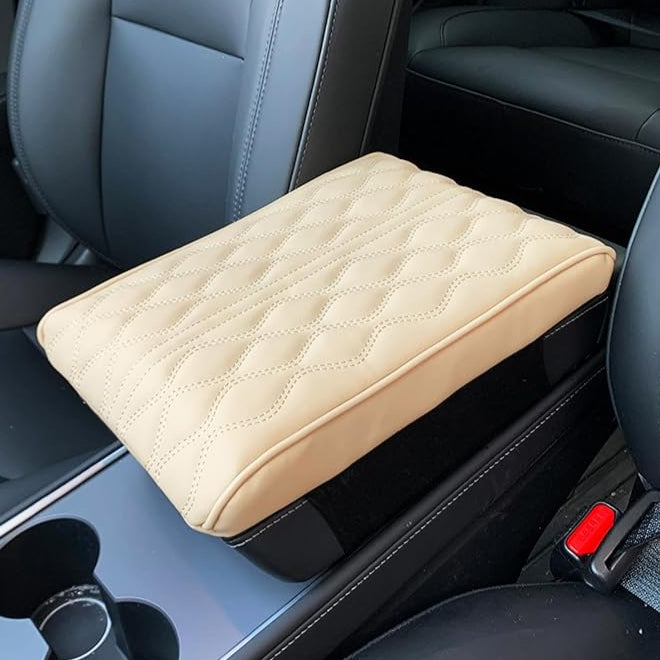 A Car Armrest Cushion is Placed on a Center Console of a Car.