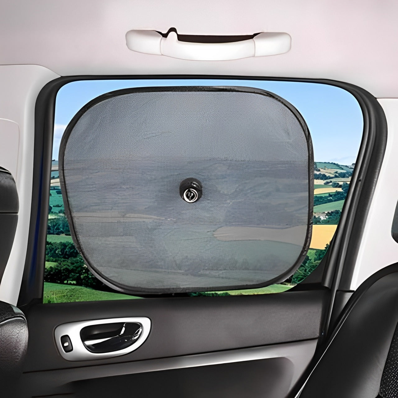 A Car Sun Shade is Fixed on a Car Window.