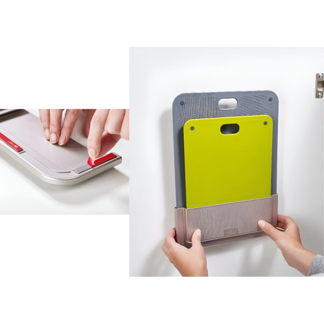 Someone is Fixing Chopping Board Set On Wall.