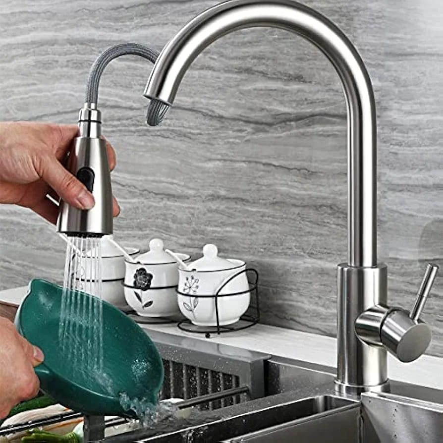 A Person is Cleaning Utensil Using Kitchen Pull Out Tap.