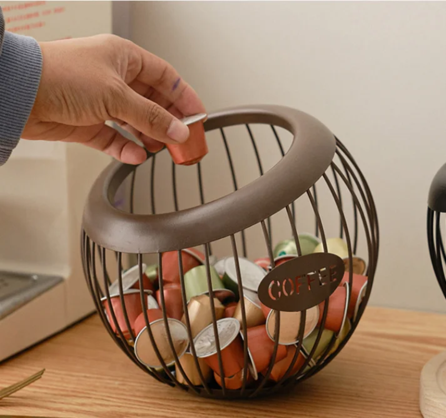 A Person is Taking Coffee Pod From Coffee Pod Holder.