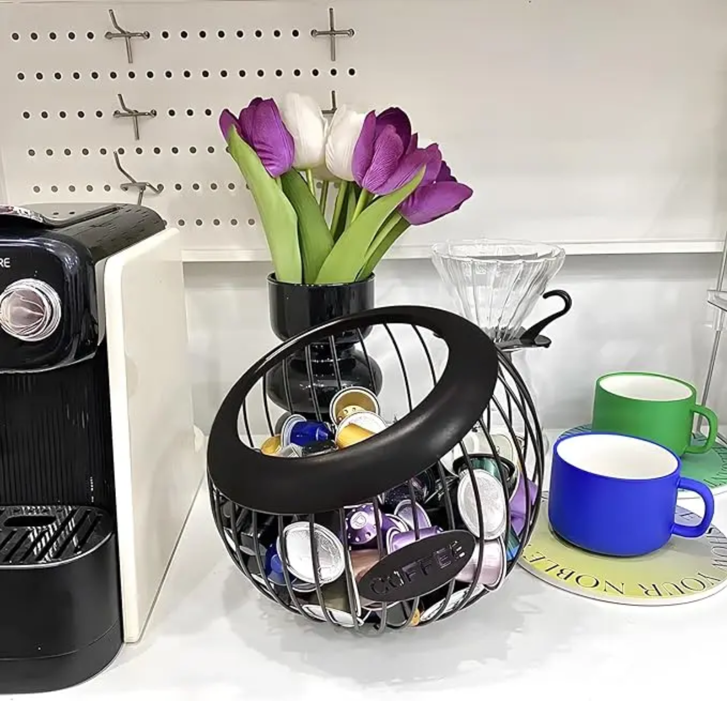 A Coffee Pod Holder with Coffee Pods are Placed Near Coffee Machine.
