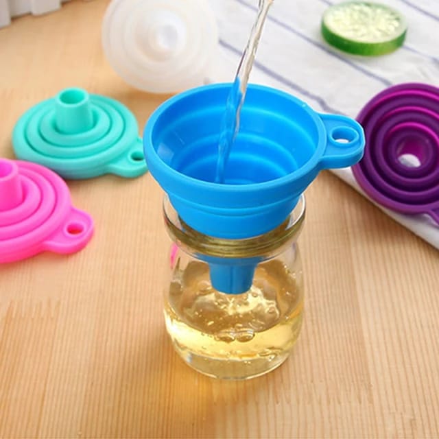 pouring oil into a bottle using a Silicone Telescopic Collapsible Mini Funnel
