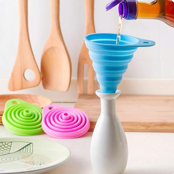 pouring oil into a bottle using a Silicone Telescopic Collapsible Mini Funnel